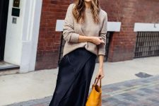 25 a tan jumper, a navy slip midi skirt, white trainers and a mustard tote for a lovely and girlish look