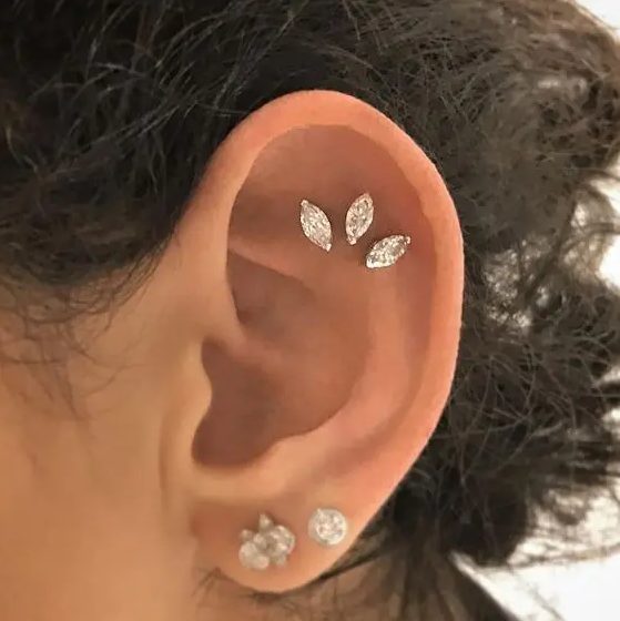 a triple flat piercing with lovely rhinestone studs and a double lobe piercing with two cool studs are a great idea