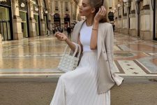 27 a white tee, a creamy pleated midi, a tan oversized blazer, dad sneakers and a pearly bag