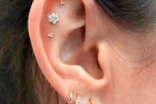 32 chic ear styling with a triple flat and a triple lobe piercing, with gold hoop and stud earrings is a beautiful idea