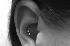 38 a triple conch piercing done with rhinestone studs is a stylish and out-of-the-box idea to stand out for sure