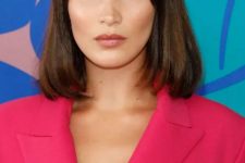 Bella Hadid wearing a shoulder-length dark brown bob with blunt bangs looks veyr chic and very stylish and such a hairstyle is timeless