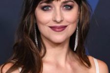 Dakota Johnson’s bangs are thick and blunt and soft all at the same time