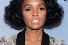 Janelle Monae’s fluffy waves have a vintage pin curl effect, there are soft waves rippling over her forehead, and the round, cloud-like shape the hair takes as it moves out from her head.