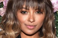 Kat Graham’s cute, razored fringe with long ombré waves is a fun, modern take on the straight bangs, curly body contrast