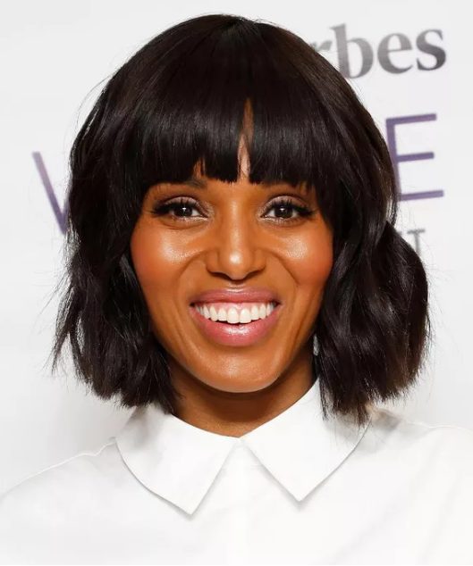 Kerry Washington's straight bangs juxtaposed with a wavy lob perfectly frames her oval face and (killer) bone structure