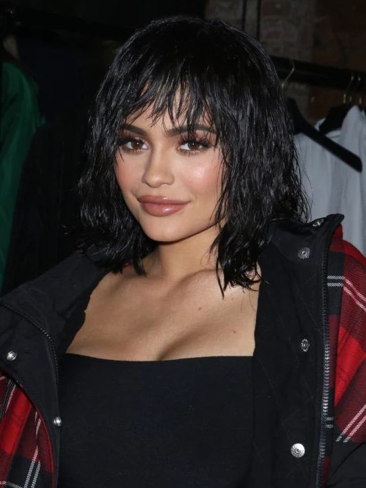 Kylie put her unique stamp on the long bob hairstyle with choppy, tough-chic layers and a glossy, almost wet-look finish