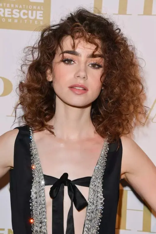 Lily Collins' windswept bangs almost seem like a fruitful style accident, but truthfully a lot of effort likely went into getting them to look that way