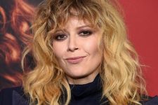 Natasha Lyonne’s go-to cut has those signature layers all over and wispy, curly moon bangs