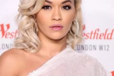 Rita Ora’s lifted roots and dramatically curled side bangs have an old Hollywood starlet vibe