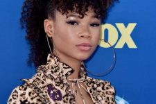 Storm Reid’s curly faux-hawk is such a unique way to style medium-length or long curls, the choppy fringed pieces at the front create a longer bang that falls just past her eyebrows