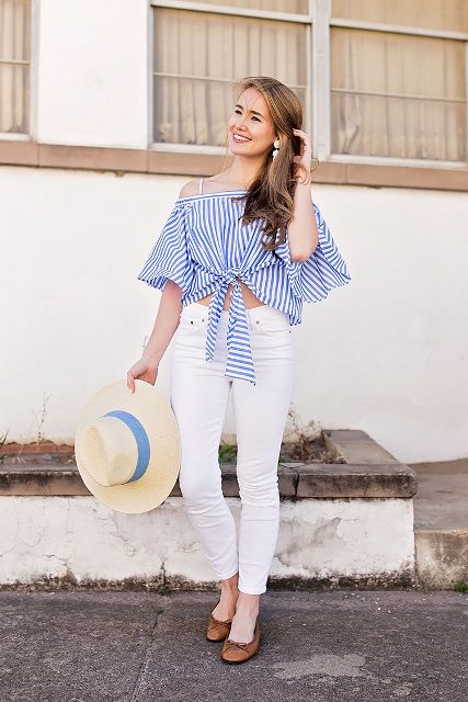With beige and blue wide brim hat, white skinny jeans and brown flat shoes