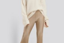 With beige oversized sweater and beige heeled mules