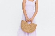 With beige straw tote bag and white leather flat sandals