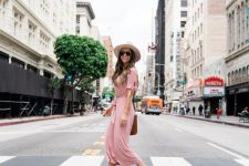 With beige wide brim hat, oversized sunglasses, brown leather bag and flat sandals