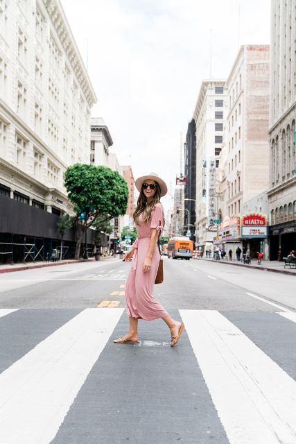 With beige wide brim hat, oversized sunglasses, brown leather bag and flat sandals