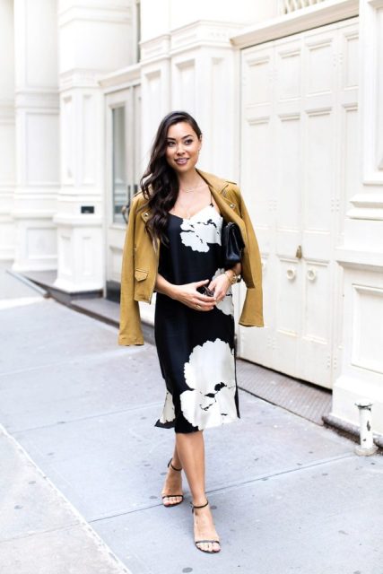 With black and white floral printed midi dress, leather bag and black ankle strap shoes