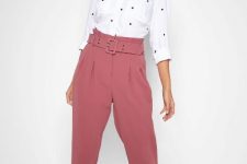 With black and white polka dot button down three quarter sleeved shirt and beige lace up flat shoes