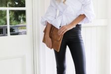 With black leather leggings, brown suede clutch and black ankle strap high heels