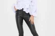 With black leather skinny pants and high heeled shoes