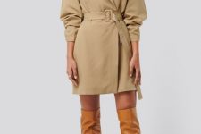 With brown patent leather over the knee boots and golden earrings