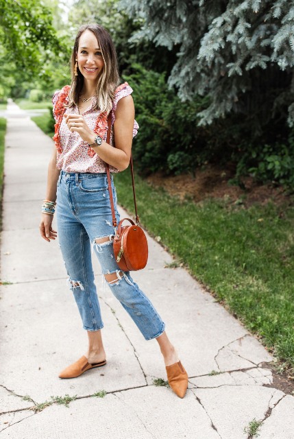 With distressed cropped jeans, red leather rounded bag and brown flat shoes
