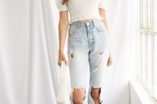 With golden earrings, white bag, super distressed cropped jeans and light yellow low heeled sandals