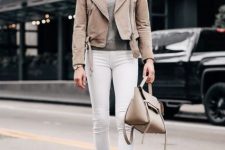 With gray shirt, sunglasses, white jeans, beige bag and white pumps