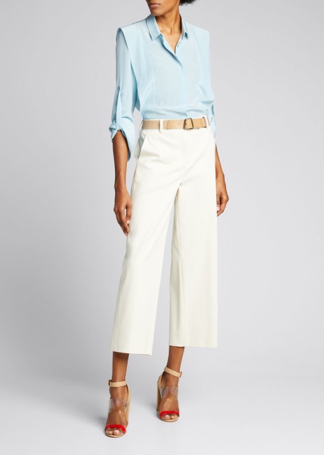 With light blue button down shirt and beige and red ankle strap high heels
