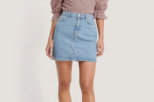 With light blue denim mini skirt and white lace up high heels