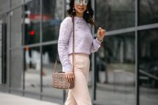 With lilac loose blouse, mirrored sunglasses, beige leather embellished bag and platform shoes