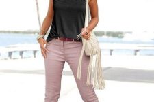 With sunglasses, black satin sleeveless top, white fringe bag and lilac sandals