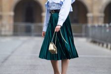 With sunglasses, emerald green pleated midi skirt, black belt, golden chain strap bag and black and beige low heeled shoes