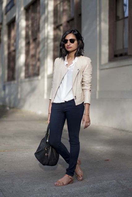 With white button down shirt, navy blue jeans, sunglasses, black leather bag and low heeled sandals