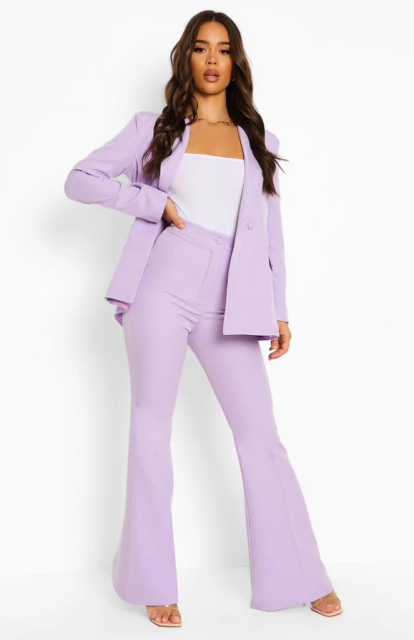 With white fitted top, lilac blazer and high heels