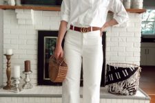 With white loose button down shirt, straw bag and gray ankle strap heeled shoes