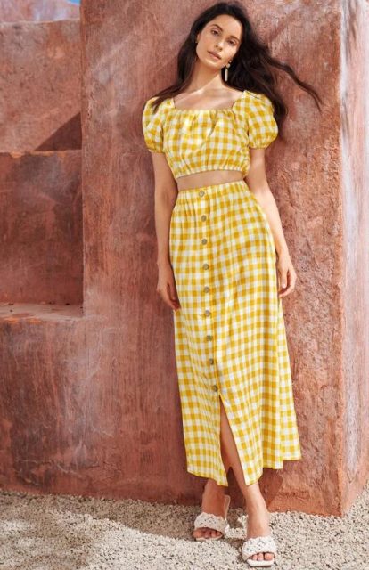 With white low heeled mules and yellow and white checked button front maxi skirt