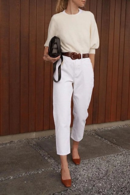 With white t-shirt, beige three quarter sleeved sweater, black leather bag and brown leather flat shoes