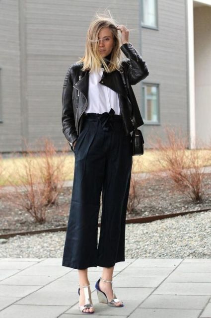With white t-shirt, black leather jacket, black bag and navy blue and silver platform sandals