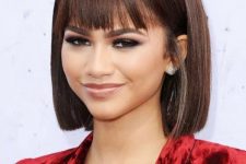 Zendaya rocking a sleek bob and pin-straight fringe looks unusual and very stylish, and such a hairstyle is actually classics