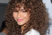 Zendaya’s full head of spiraling ringlets is accented with equally curly bangs, you may always cut them a little shorter