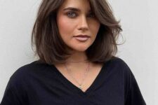 a brown long bob with side bangs, messy waves and a lot of volume is a chic and lovely idea to rock