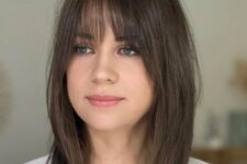 a brunette long bob with wispy bangs is a cool idea, and such bangs will accent the eyes