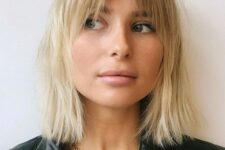 a chic long blonde bob with a darker root and curtain and bottleneck bangs is a catchy 70s inspired solution