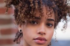 a cute combo of a septum and nostril piercing is a stylish idea to add brightness to your look