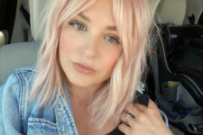 a light pink long bob with curtain bangs is a sweet and cute idea for a modern and bold look