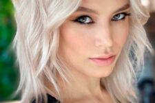a platinum blonde long bob with side bangs and waves is a chic and bold idea, make a statement with color