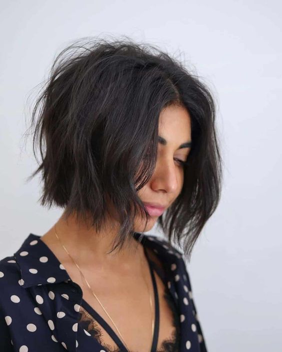 a pretty short black shaggy bob with a bit of mess and much volume is a stylish and cool idea to rock
