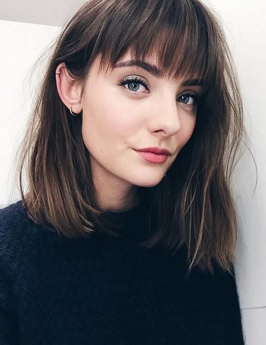 a shoulder-length brown bob with highlights, blunt bangs is a very cool and beautiful idea for a modern look