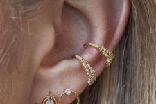chic and glam ear styling with a double lobe piercing, a double conch piercing done with beautiful and refined gold earrings